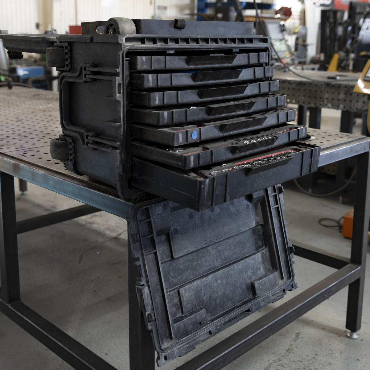 Military tool kit with drawers pulled out