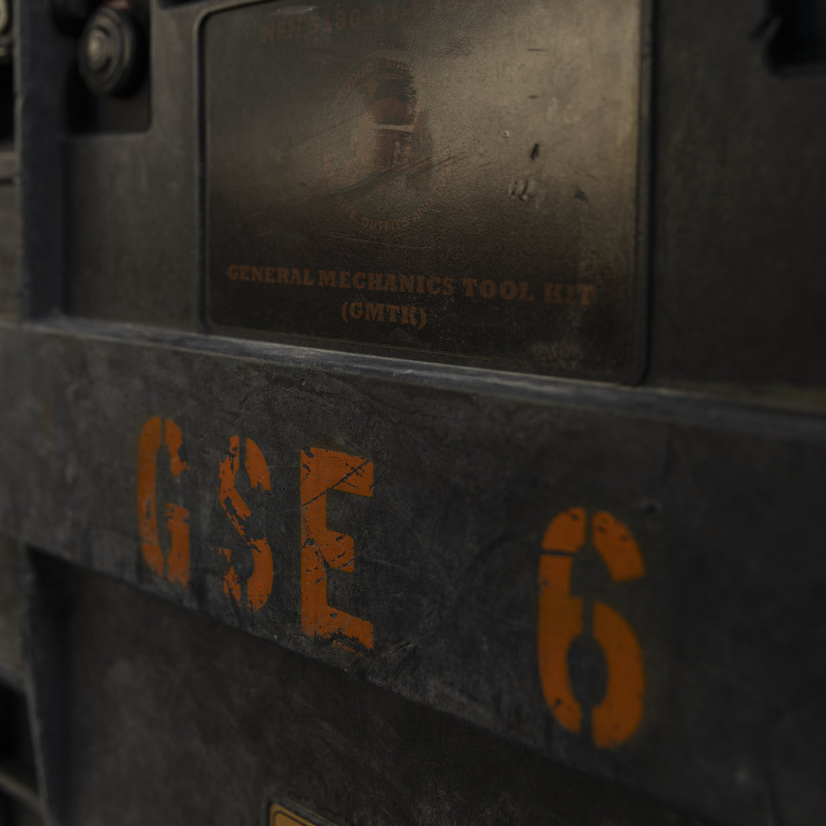 Close-up of stenciled markings on the tool kit case