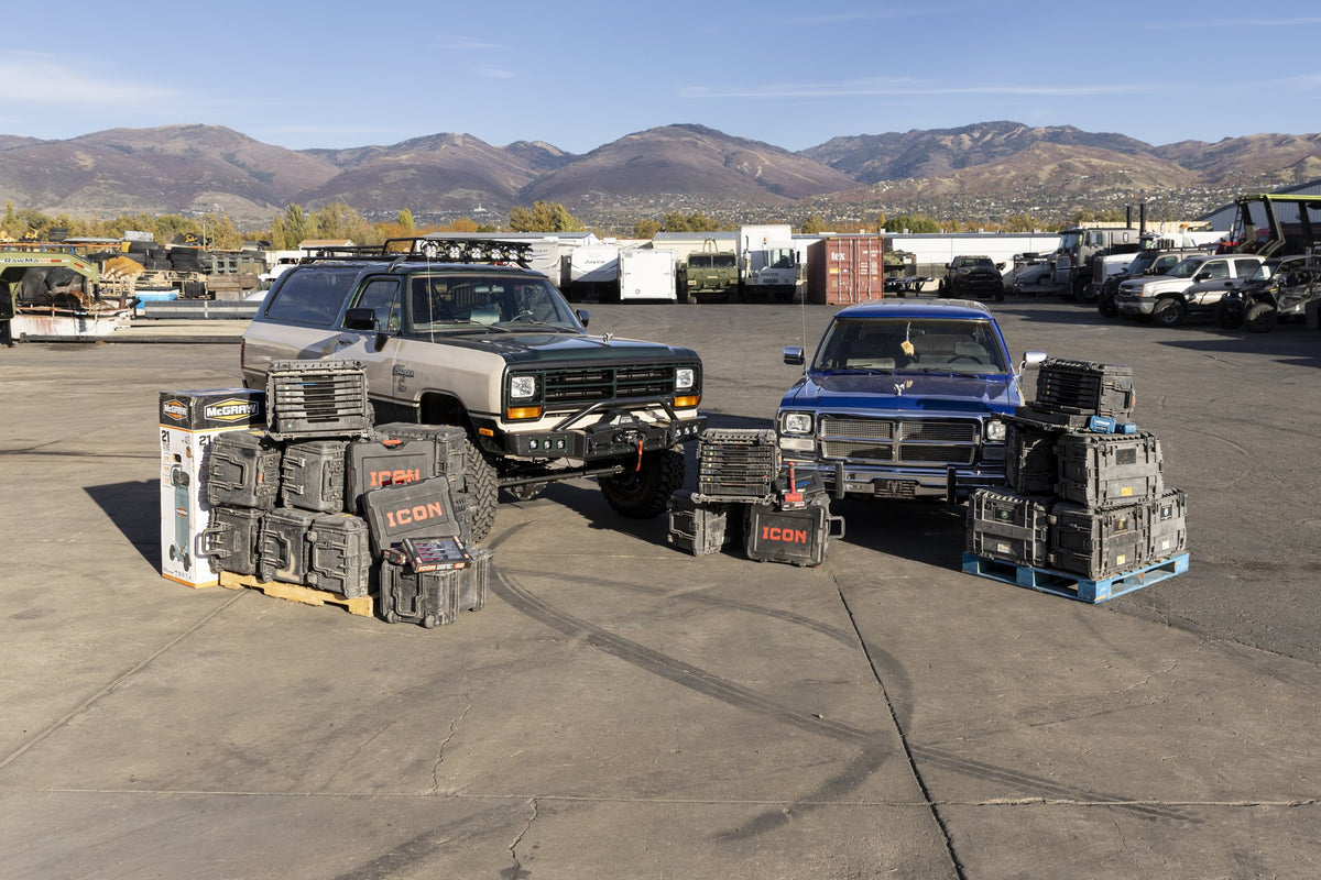 Both Ram Chargers with stacks of tool kit cases