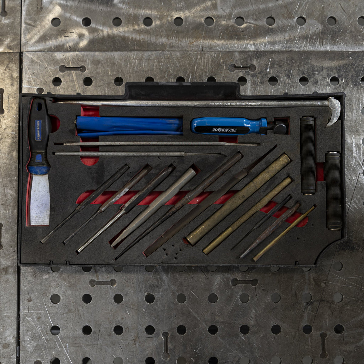 Tool tray with pry bars and punches