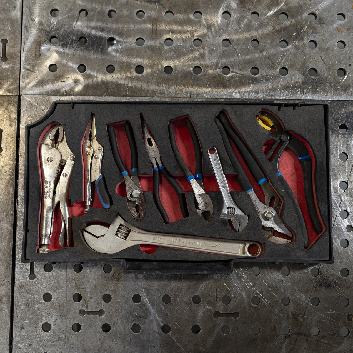 Tool tray with pliers and adjustable wrenches